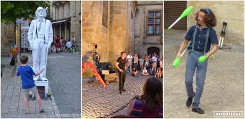Street entertainers perform on or near Place de la Liberte