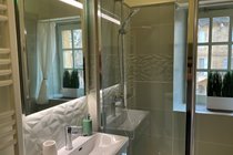 Bright newly remodelled bathroom with walk-in shower