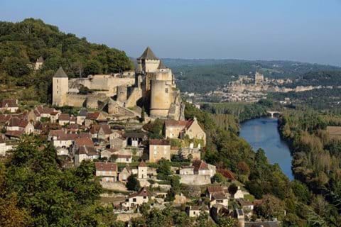 The village of Beynac and Cazenac is perched on a cliff side and overlooks the Dordogne