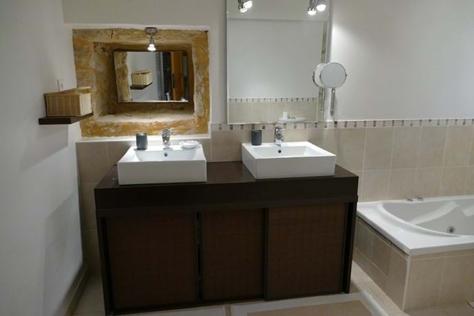 En suite bathroom for Bedroom One with double vanity unit