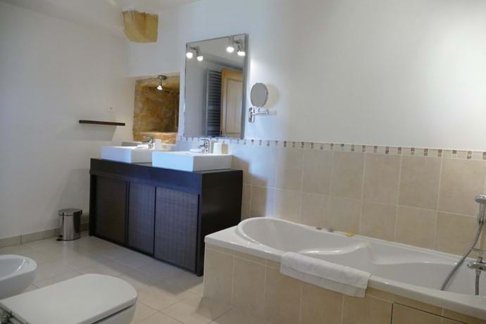 En suite for Bedroom One with spa bath, shower, double vanity, wc & bidet