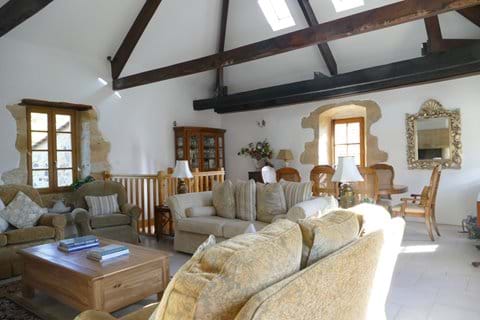 The sitting room /dining room is open to the rafters