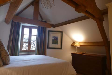 The bedroom overlooks the fields at the front of the property