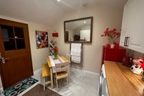Kitchen/library/laundry room for our guests