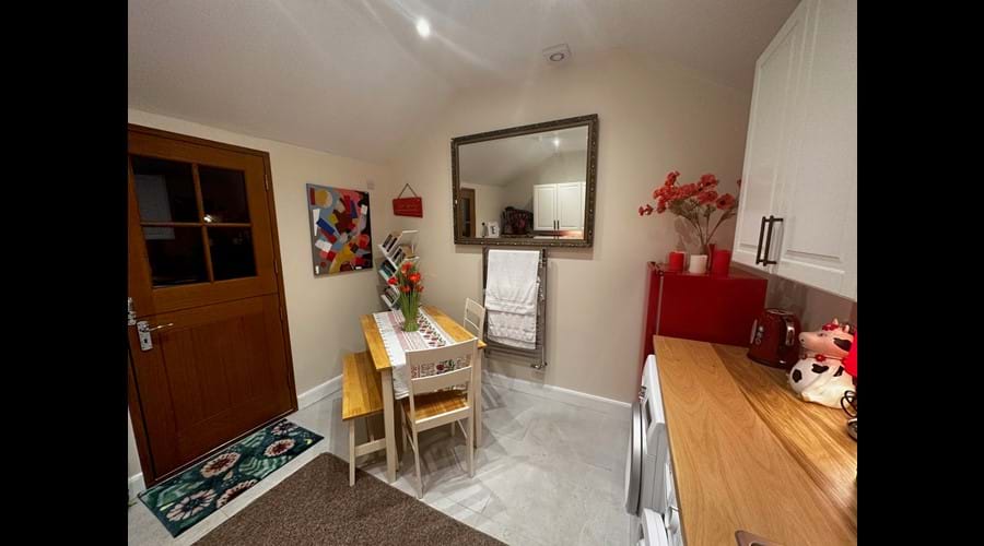 Kitchen/library/laundry room for our guests