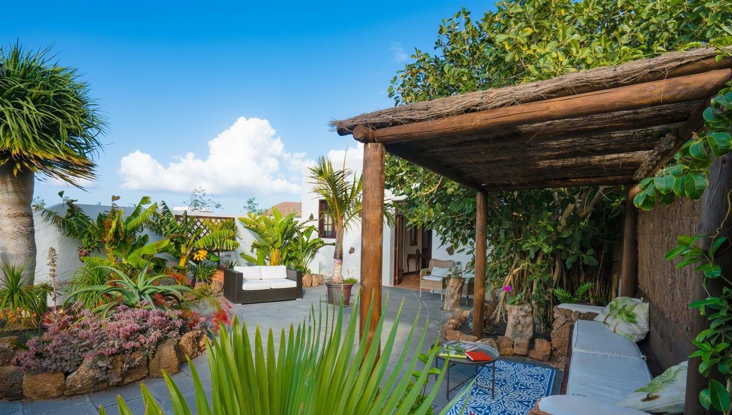 View of the garden and outdoor seating in the Garden Apartment at Finca Botanico, Lanzarote