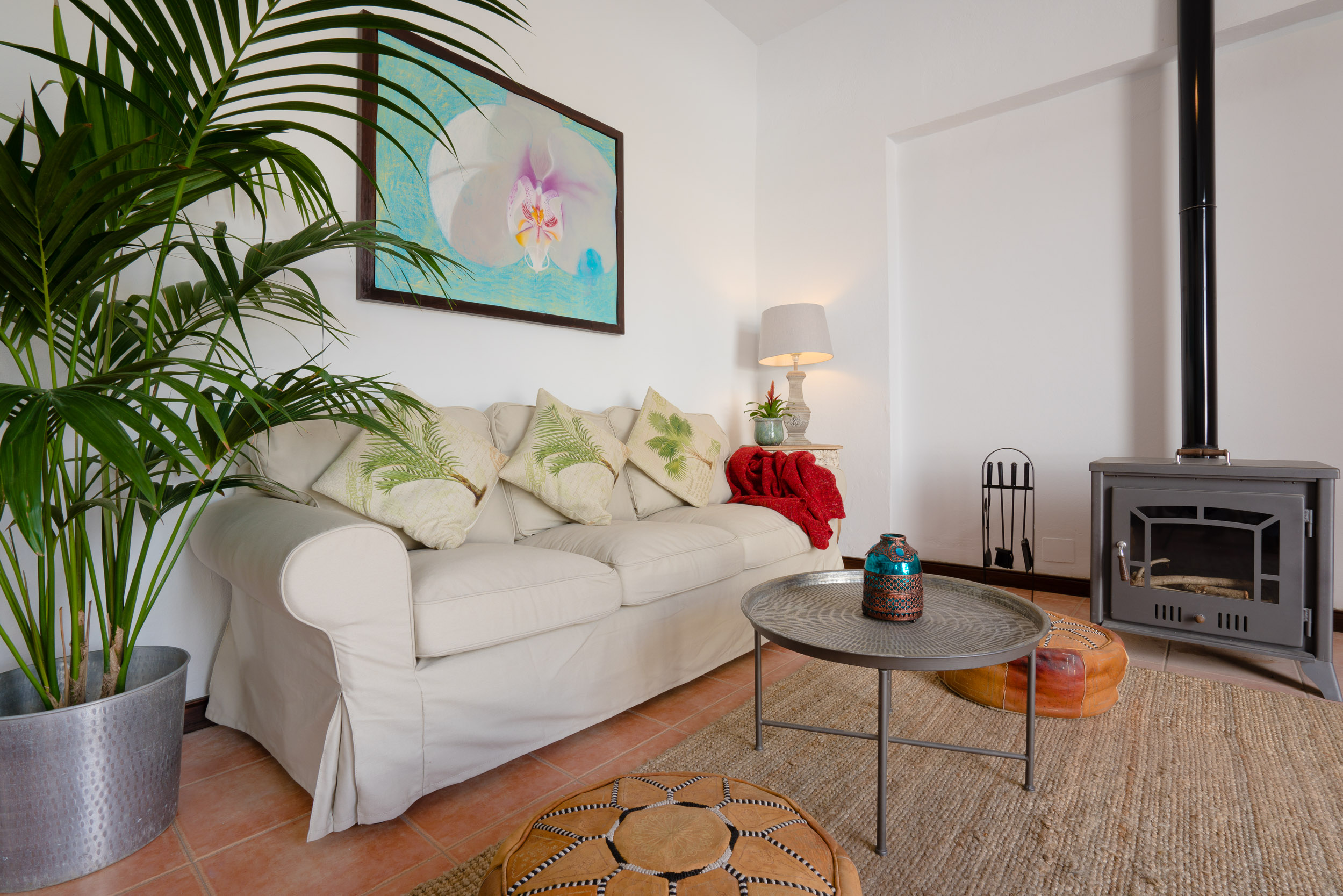 The orchid painting on the wall is by the owner