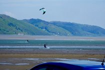 Kite surfers at the Dovey estuary, from Ynyslas sand dunes.