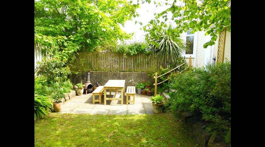 Our "secret" garden offers privacy along with a picnic table and bbq