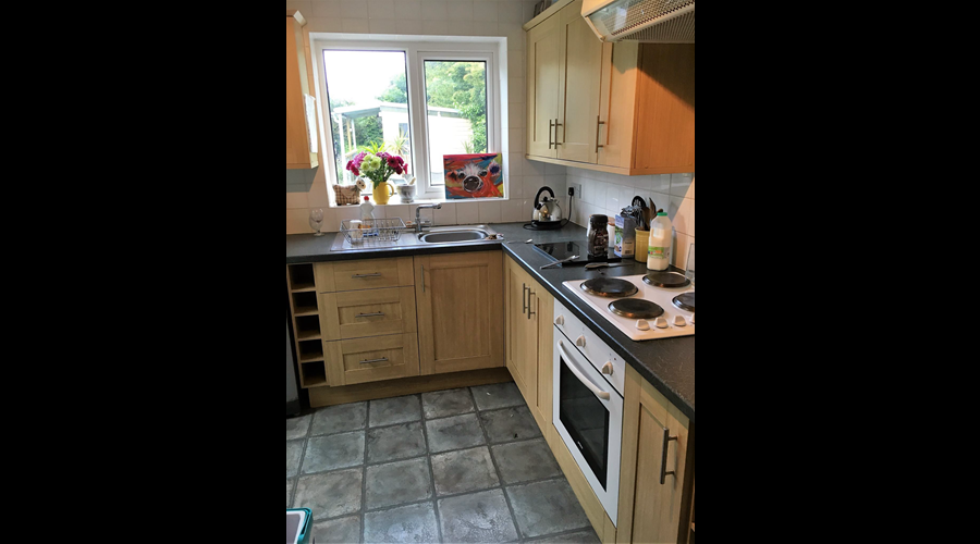Kitchen, with washer/dryer, Fridge/freezer, microwave, and slow cooker, iron etc etc