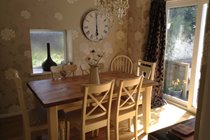 The pretty dining room with patio doors for the lovely hot! Welsh summer days