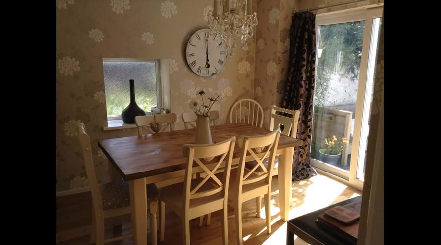 The pretty dining room with patio doors for the lovely hot! Welsh summer days