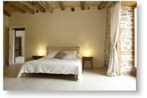 Exposed walls, beams and natural lime paints