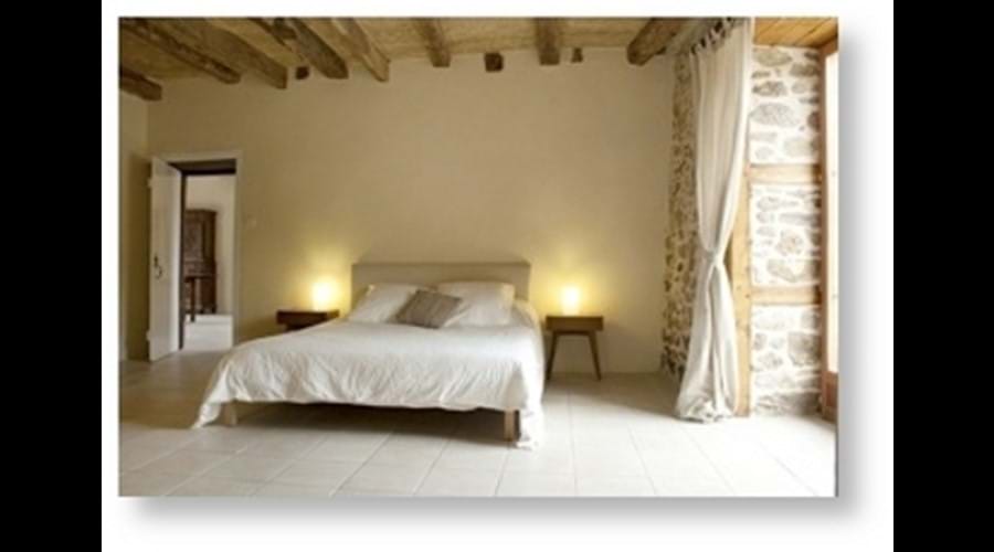 Exposed walls, beams and natural lime paints