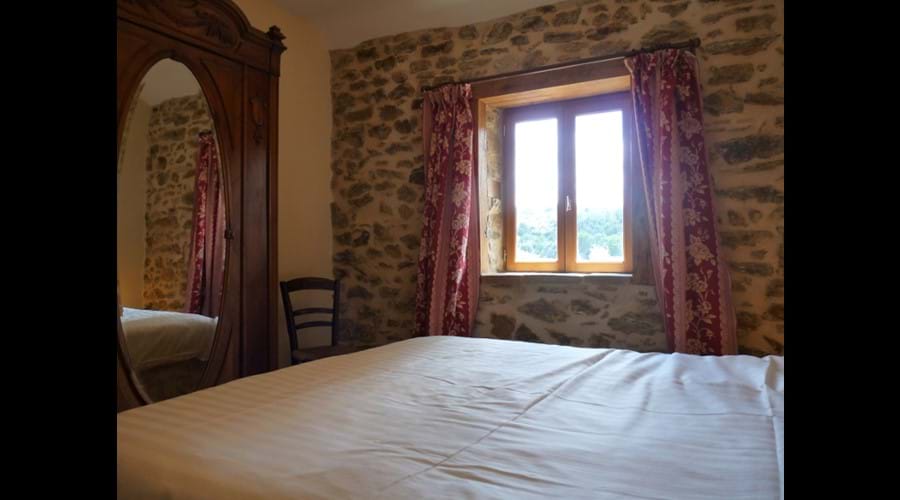 One of the comfortable beds in River View Cottage