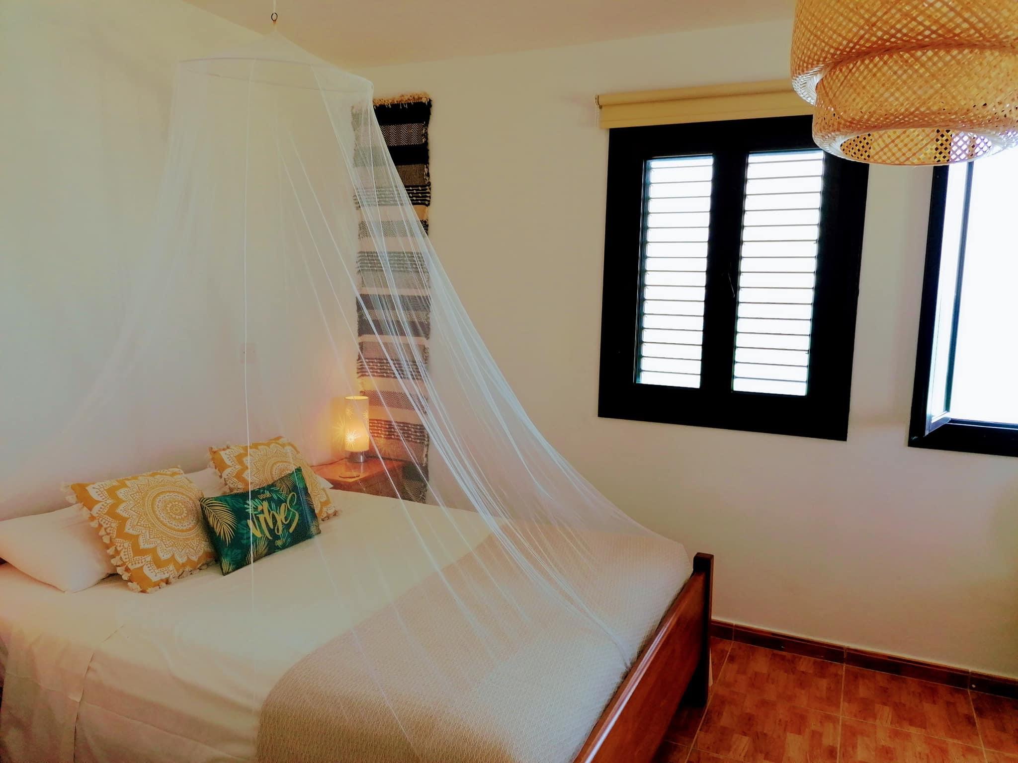 Bedroom with mosquito net for those who like to sleep with windows open