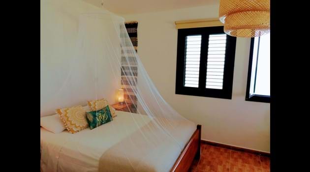 Bedroom with mosquito net for those who like to sleep with windows open