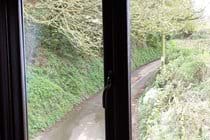 View from double bedroom onto a quiet single track lane