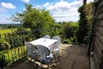 Raised terrace, overlooking the lawned cottage garden and open fields