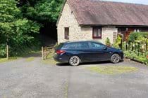 The cottage is accessed from the single track country lane, with parking for 2 cars right outside.