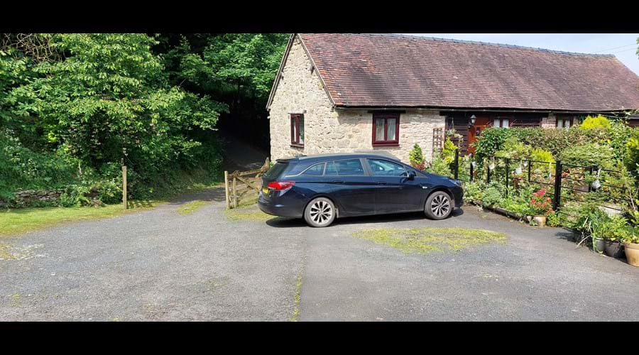 The cottage is accessed from the single track country lane, with parking for 2 cars right outside.