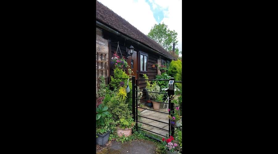 Front garden with off road parking right by the garden gate