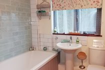 Main Bathroom with shower over the bath. There