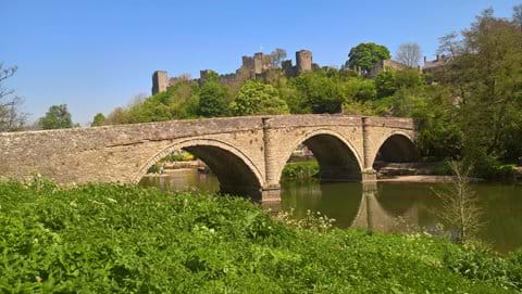 Ludlow, a medieval market town with spectacular castle overlooking the river