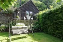 Private garden area with raised terrace accessed via French doors