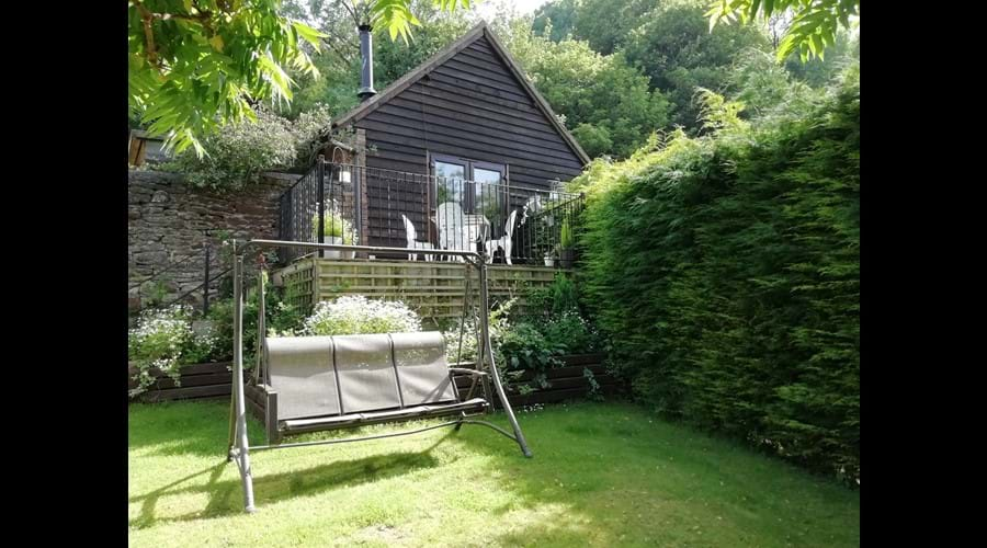 Private garden area with raised terrace accessed via French doors