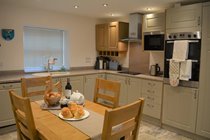 Modern Kitchen with electric cooker and hob, microwave, fridge, freezer, dishwasher and washer/dryer
