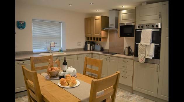 Modern Kitchen with electric cooker and hob, microwave, fridge, freezer, dishwasher and washer/dryer