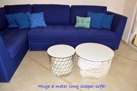 Bedding for Sofa-Bed Conveniently Located in Coffee-Table Baskets