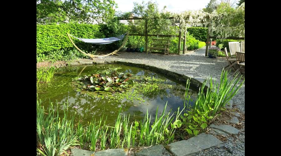 Enclosed garden with fishpond and hammock (lovely spot for a snooze or some outdoor dining)