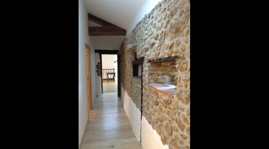 The landing with exposed stonework