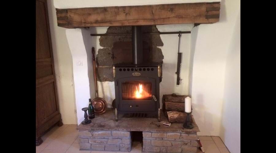 Original bread oven behind fireplace