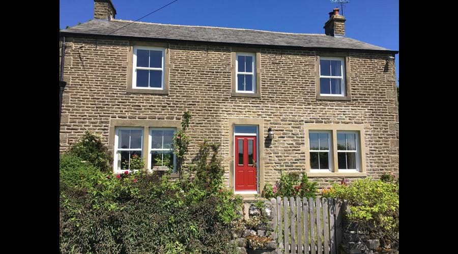 Drive past this nice red door, open the gates and reverse in to the cream side door