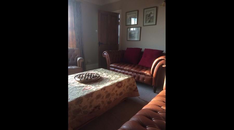 The sitting room with log fire