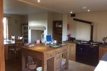 Bespoke wooden kitchen with electric Aga