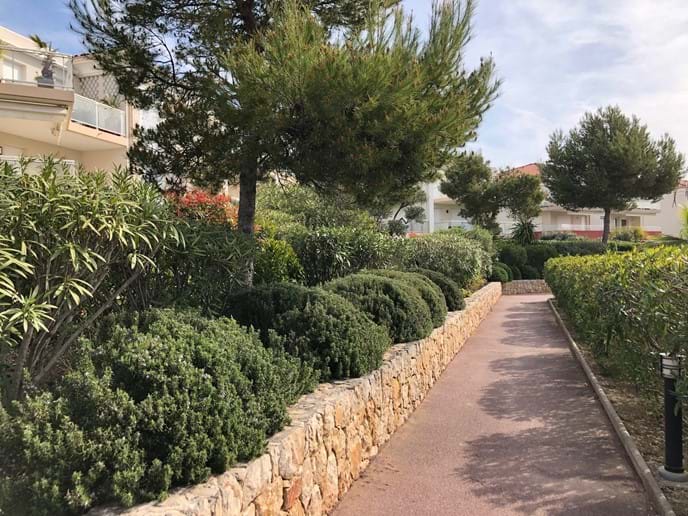 The provencal landscaped walkways within the Domain