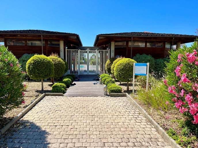 Entrance to the Pool-area. In the poolhouse there are showers and changing-rooms