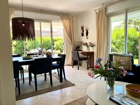Bright living-room with large sliding doors leading out to the terrace and garden