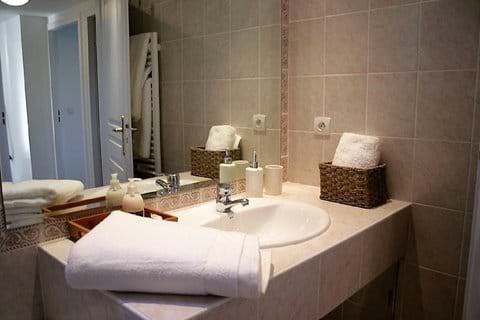 Bathroom with tub. Separate WC with sink.