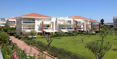 Lowrise buildings at the Domain. Gardener maintained landscape with flowers, trees and lawns