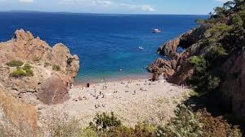 The secret beach of TheouleSurMer. The brave ones takes a jump from the rocks, or swim through the cave