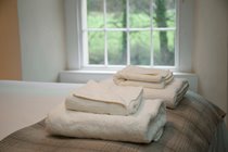 Luxury cotton linen and fluffy white towels are provided