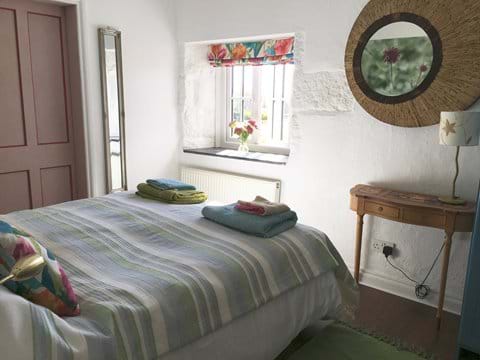 Bedroom with lovely views over the pond and garden. Twin or Kingsize bed