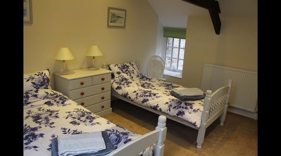 Twin bedroom with original exposed beams