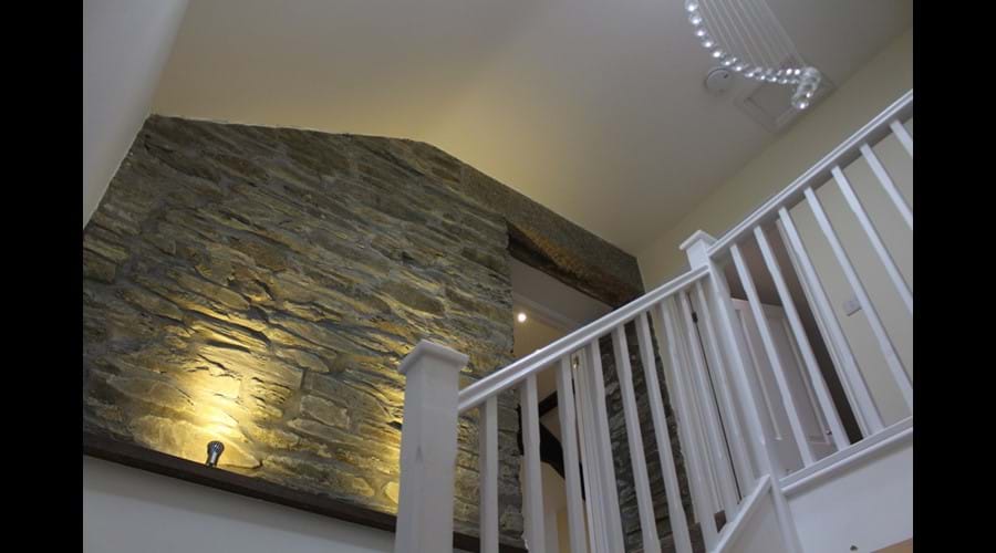 The original apple barn feature wall to stairs