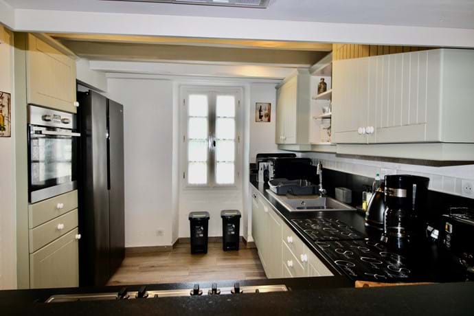 Fully equipped kitchen area with American Fridge/Freezer, dishwasher, oven, hob, microwave, coffee maker, toaster